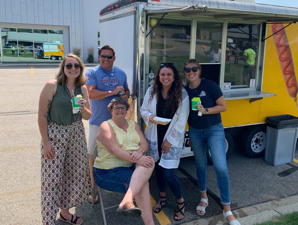 Veneklasen Construction employees at picnic with food truck